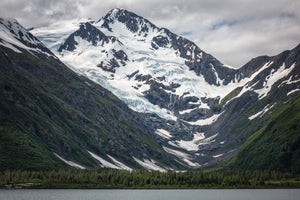 Byron Peak and its glacier rises up from Portage Lake, Alaska